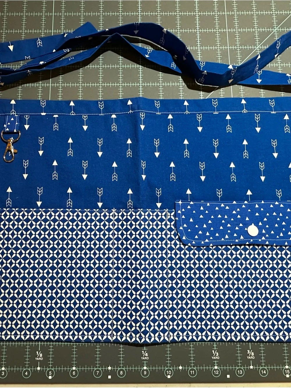 Blue Patterned Apron with Pockets across the front and a Snap Pocket